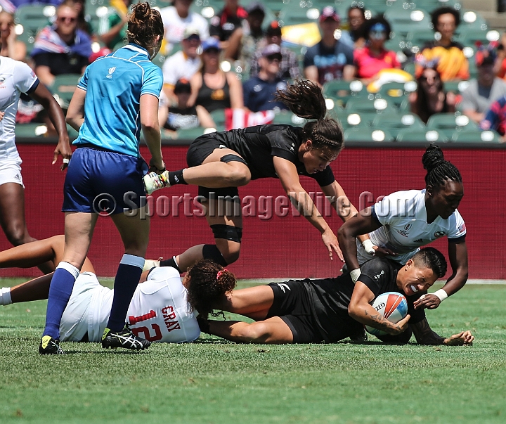 2018RugbySevensSat-15.JPG - Gayle Broughton of New Zealand is tackled by Jordan Cray (12) of the United States in the women's championship semi-finals of the 2018 Rugby World Cup Sevens, Saturday, July 21, 2018, at AT&T Park, San Francisco.  New Zealand defeated the United States 26-21.  (Spencer Allen/IOS via AP)